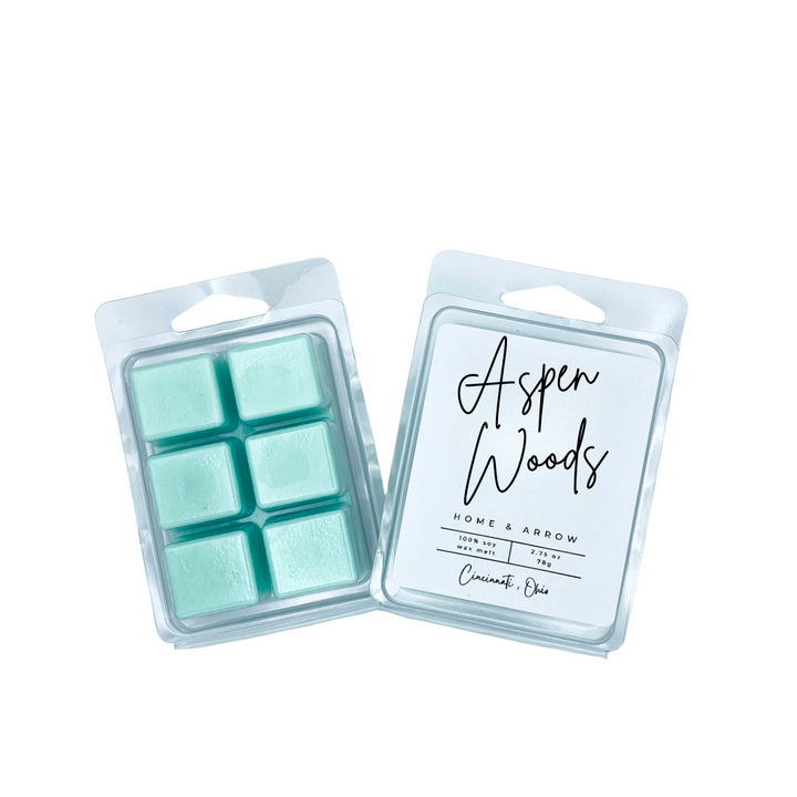 Aspen Woods teal soy wax melts in clamshell packaging on a white background from Home & Arrow based in Cincinnati, Ohio.