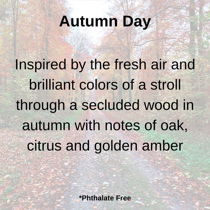 Autumn Day scent description with notes of oak, citrus, and golden amber displayed over a fall forest path background.