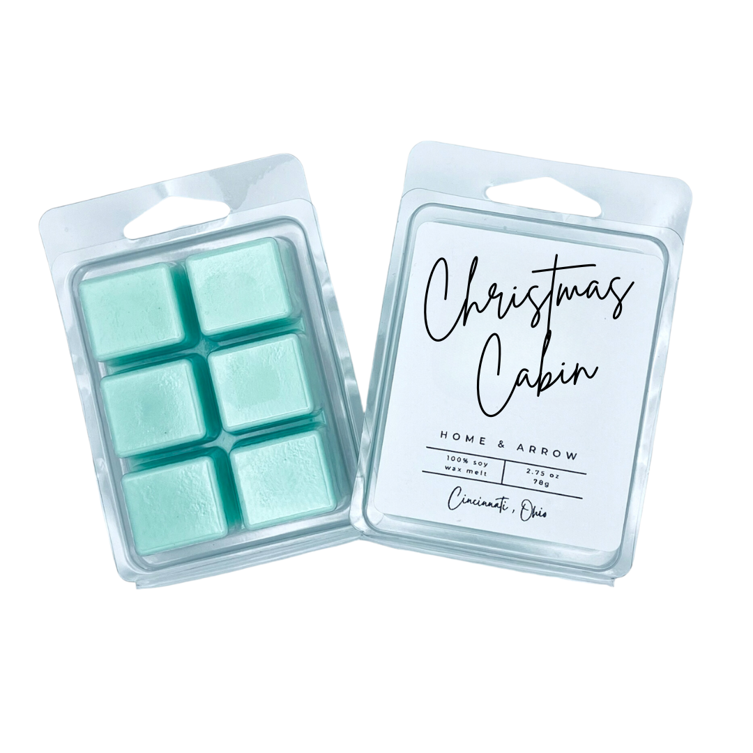 Christmas Cabin green soy wax melt in clamshell packaging on a white background fron Home & Arrow based in Cincinnati Ohio.