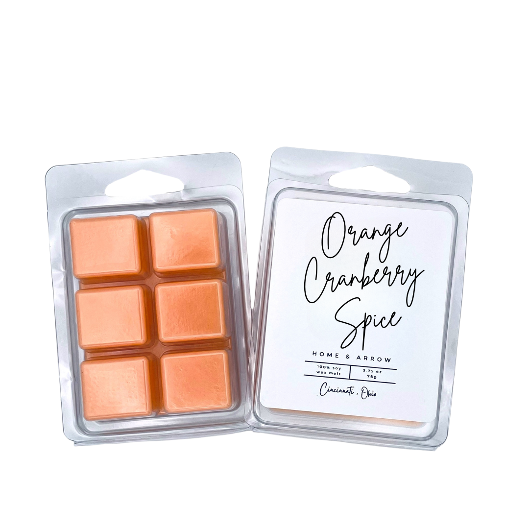 Orange Cranberry Spice orange soy wax melt in clamshell packaging on a white background fron Home & Arrow based in Cincinnati Ohio.